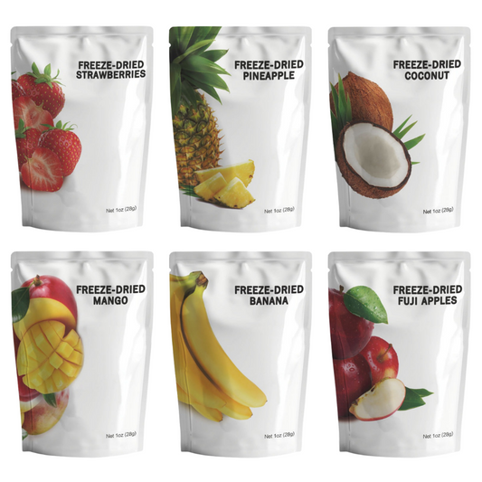 Assortment of freeze-dried fruit snack pouches including strawberries, pineapple, coconut, mango, bananas, and fuji apples.