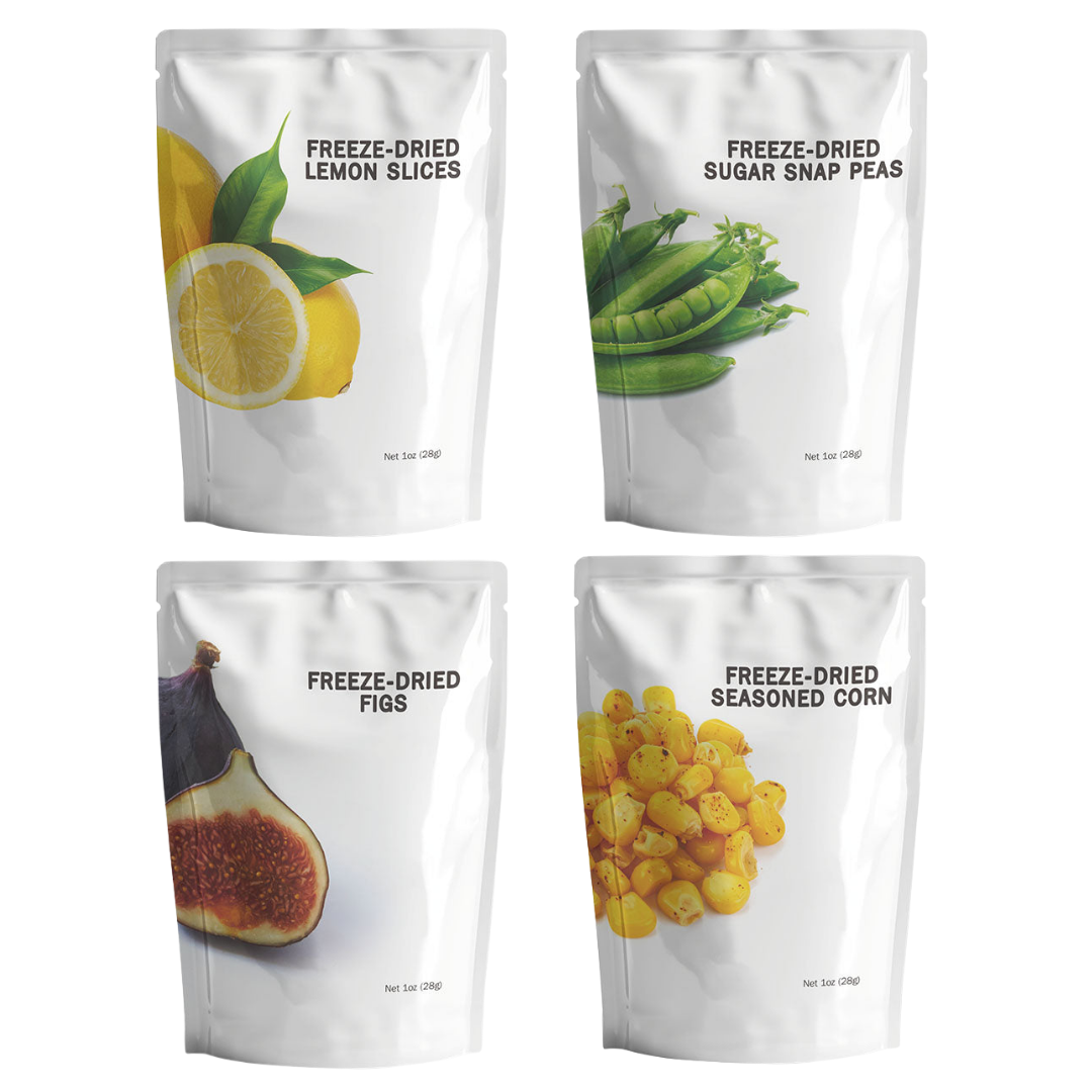 Assortment of freeze-dried fruit and vegetable snack pouches including seasoned corn, figs, sugar snap peas, and lemon slices.